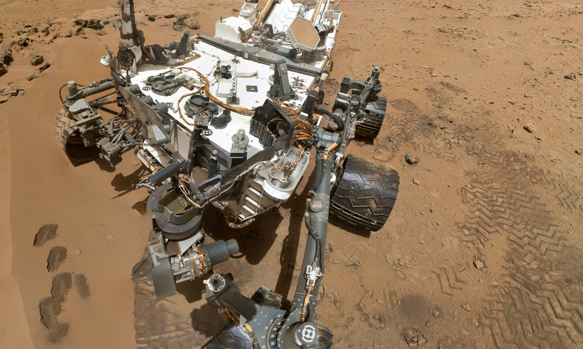 Self portrait of NASA's Curiosity rover. Curiosity is currently climbing Moount Sharp, which can be seen rising on the right-hand side of the image, seeking signs that Mars have been a habitable planet in the past.